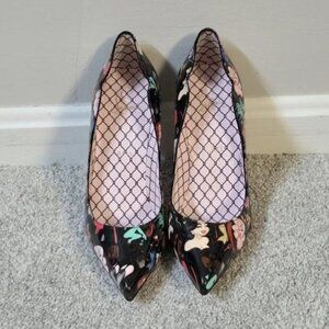 CHRISTIAN LOUBOUTIN Hot Chick 100 black patent leather graphic pin-up pumps 37.5
